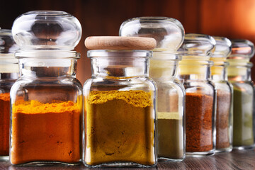 Glass storage jars with spices and herbs