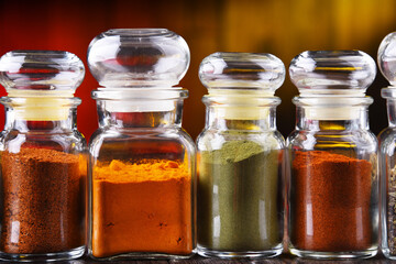 Glass storage jars with spices and herbs