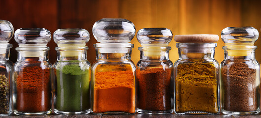 Glass storage jars with spices and herbs