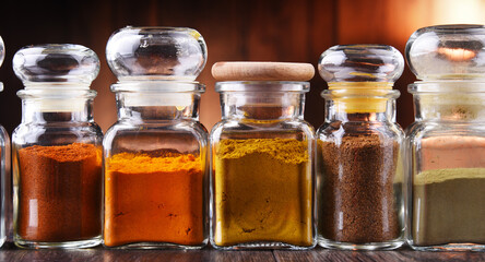 Glass storage jars with spices and herbs