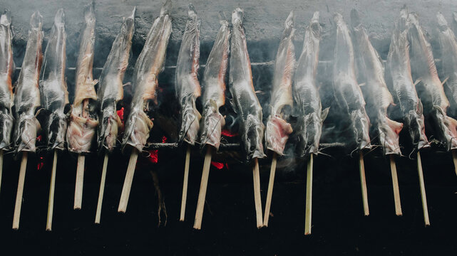 Cat fish barbecue grilled on hot charcoal stove in traditional way in Yogyakarta, Indonesia or normally called Mangut lele.