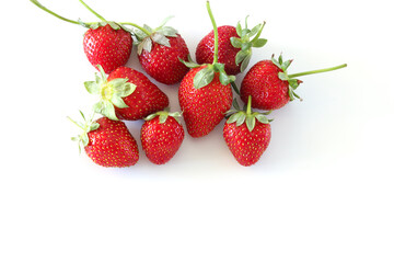Fresh red organic strawberries isolated on white background. Top view, copy space.