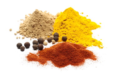 Allspice, pimento spice peppercorns with turmeric, red pepper and ginger powder piles isolated on...