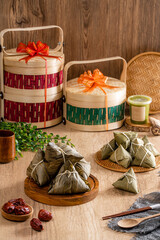 Zongzi or Bakcang is a traditional Chinese rice dish made of glutinous rice stuffed with different fillings and wrapped in bamboo leaves. They are cooked by steaming or boiling