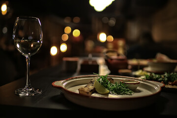 glass white wine restaurant interior, abstract evening dinner with alcohol at the bar