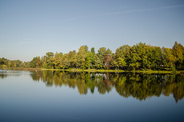 Fototapeta na wymiar Lielberkene mill lake in sunny day, Latvia.