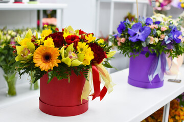 Obraz na płótnie Canvas floristic flower arrangement on the table. Fresh flowers in a box.