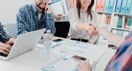 Partnerships and startups: business people shaking hands