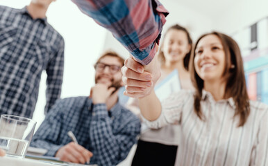Partnerships and startups: business people shaking hands