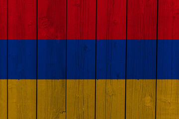 The National Flag of Armenia painted on a wooden wall. 