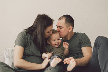 Family Love. Parents and Little Son, Having Fun Together At Home In Bed Room.