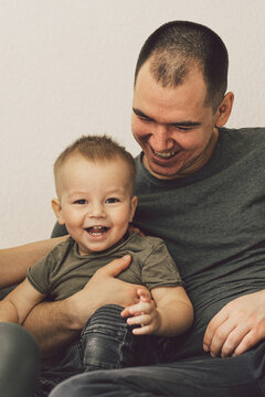 Family Love. Farher and Little Son, Having Fun Together At Home In Bed Room.