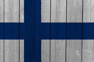 The National Flag of Finland painted on a wooden wall. 