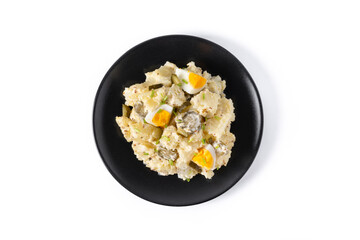 Potato salad with gherkins, egg and mustard isolated on white background. Copy space