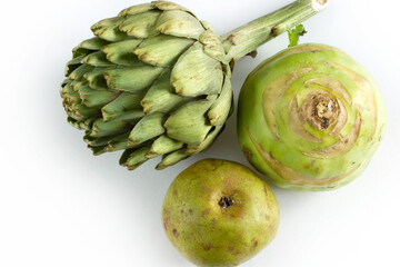 Healthy green colored vegetables and fruits. Artichoke, Kohlrabi, Pear.