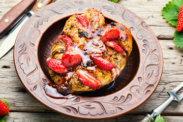 Chicken meat baked in strawberry sauce