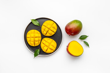 Mango slices and cubes in plate for fresh summer dinner