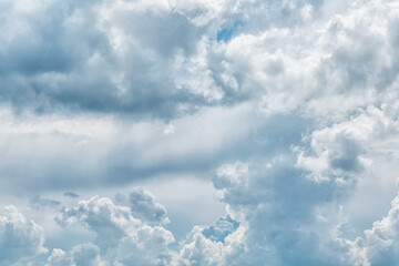 Blue cloudy sky on a sunny day. Space for text. Background.