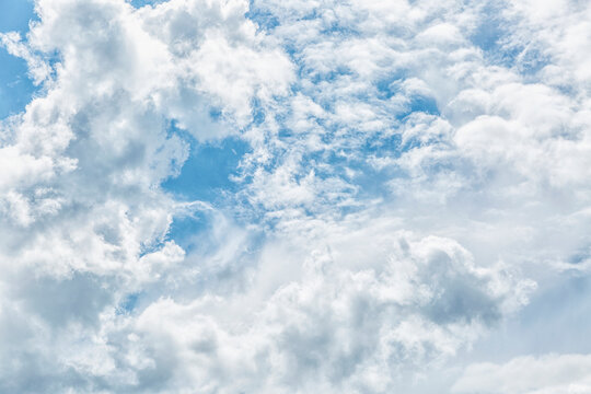Blue cloudy sky on a sunny day. Space for text. Background.