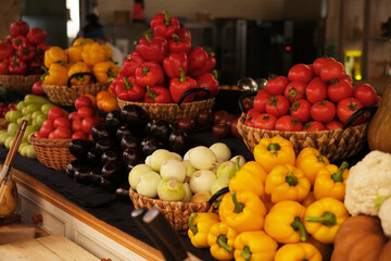 vegetable shop. onions, zucchini, eggplants, peppers, tomatoes, cabbage on the table close-up. healthy food concept