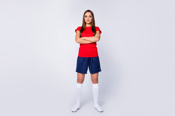 Full size photo of confident strict football captain girl cross hands ready win world final competition wear red t-shirt blue shorts white long socks sneakers isolated gray color background