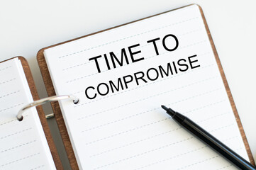 notepad with text Time To Negotiate on white table. Business concept