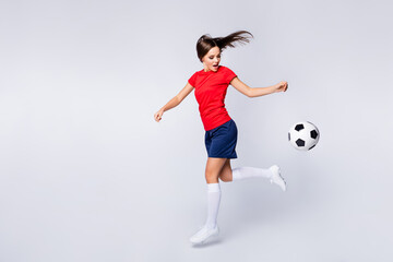 Full length profile photo of cool joy air fly player soccer team kick ball exercise training jump...
