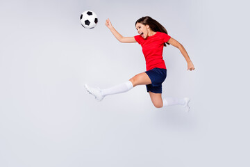 Full length profile photo of crazy air fly joy player defender soccer team game kick ball jump run pass wear football uniform t-shirt shorts cleats long knee socks isolated white color background - obrazy, fototapety, plakaty