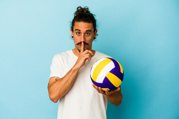Young caucasian man with long hair isolated on blue background keeping a secret or asking for silence.