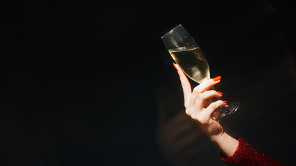 Festive toast. Party celebration. Holiday spirit. Advertising background. Unrecognizable woman hand...