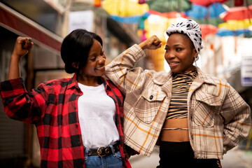 Portrait of a happy smiling female friends. Women laughing and having fun outdoors
