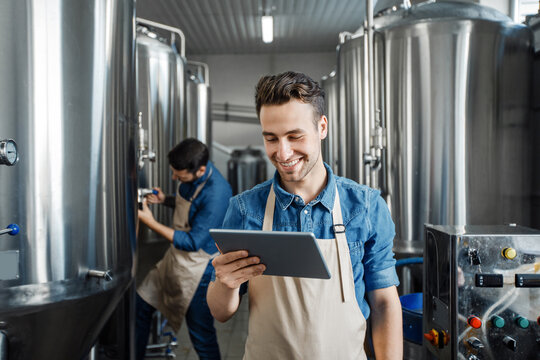 Family business, brewers working in craft beer brewery, control production