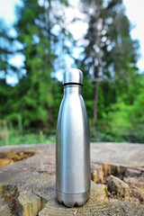 Reusable water bottle. Stainless steel reusable water bottle. Close-up of steel eco thermo water...