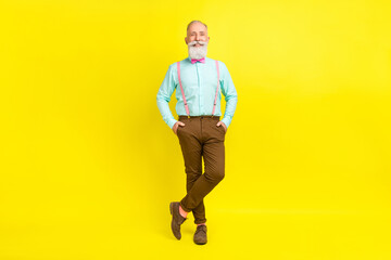 Fototapeta na wymiar Full length body size photo gentleman wearing teal shirt suspenders isolated bright yellow color background