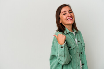 Middle age caucasian woman isolated on white background points with thumb finger away, laughing and carefree.