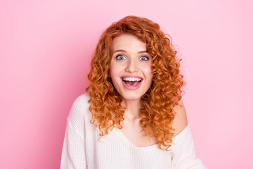 Photo portrait of red haired curly woman staring amazed with opened mouth smiling isolated on...