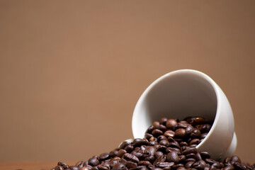 cofee beans in a white ceramic cup.