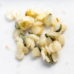 several cores of hemp seeds close up on gray