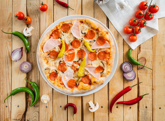 tasty pizza on the wooden background