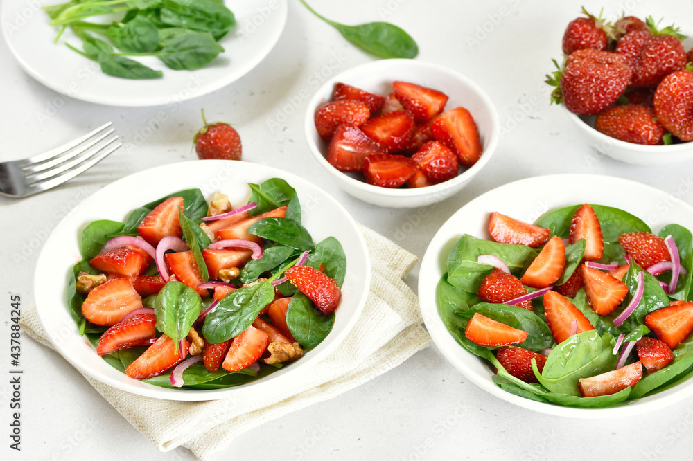 Poster Healthy breakfast with fruit salad from strawberry, spinach and walnut