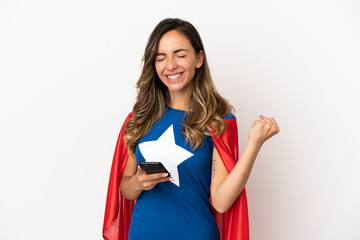 Obraz premium Super Hero woman over isolated white background with phone in victory position