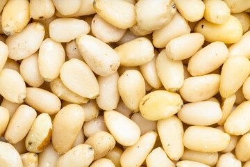 background - many shelled pine nuts
