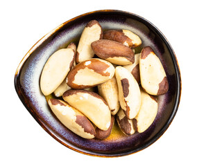 top view of brazil nuts in ceramic bowl isolated