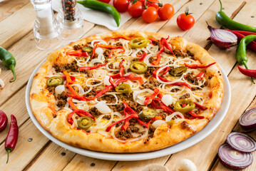 tasty pizza on the wooden background