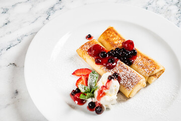 pancakes with strawberries and mint