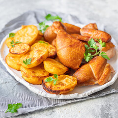 chicken pieces and potatoes fried , baked vegetable poultry meat organic dish on the table healthy food meal snack copy space food background rustic 