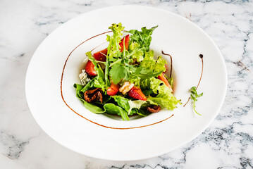 healthy salad with strawberries and cheese