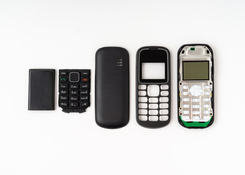 Old and outdated mobile phone set isolated on white background.