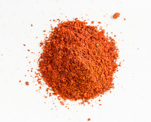 view of pile of paprika powder close up on gray