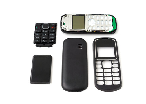 Old and outdated mobile phone set isolated on white background.